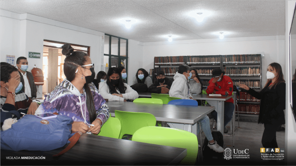 Group of teachers working at the library tables