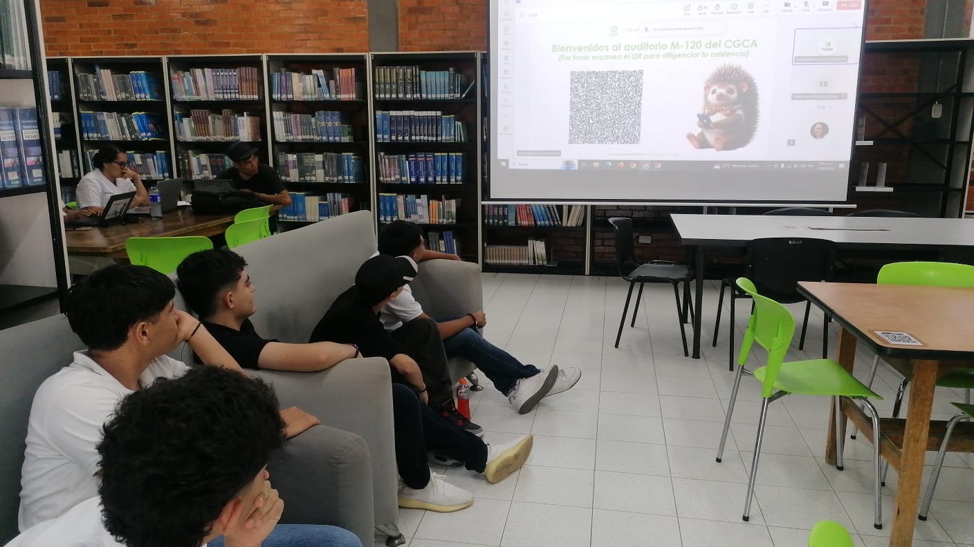 Students sitting on sofas in the CGCA reading room follow the presentation of the IPA Thinker Awards 2024 projected in the background.